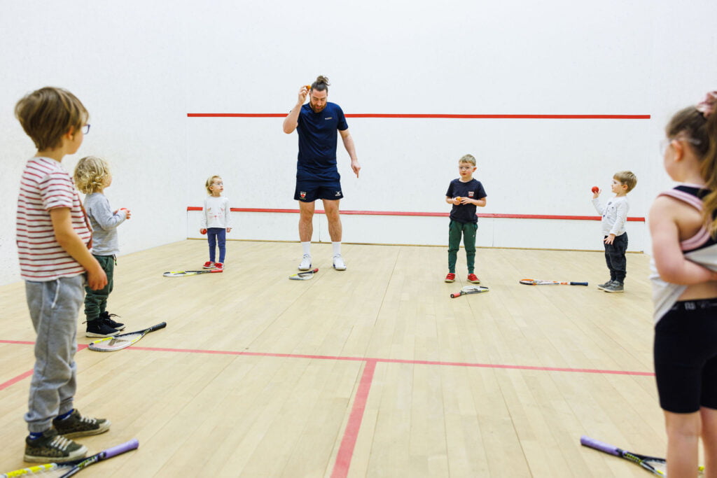 Kit Pearman teaching a junior squash class