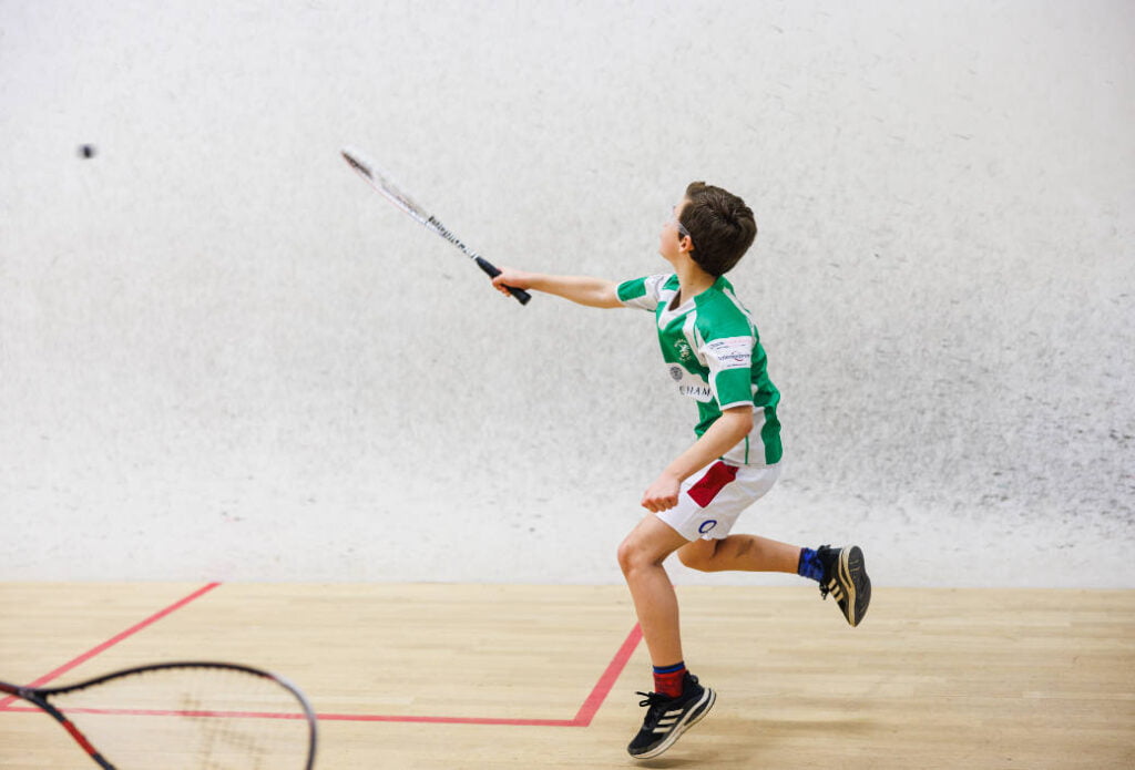 A junior member playing squash