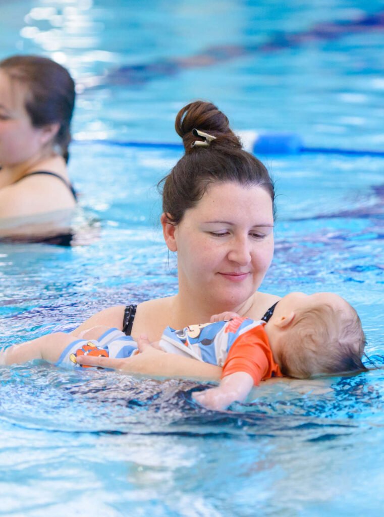 Mother and baby swimming