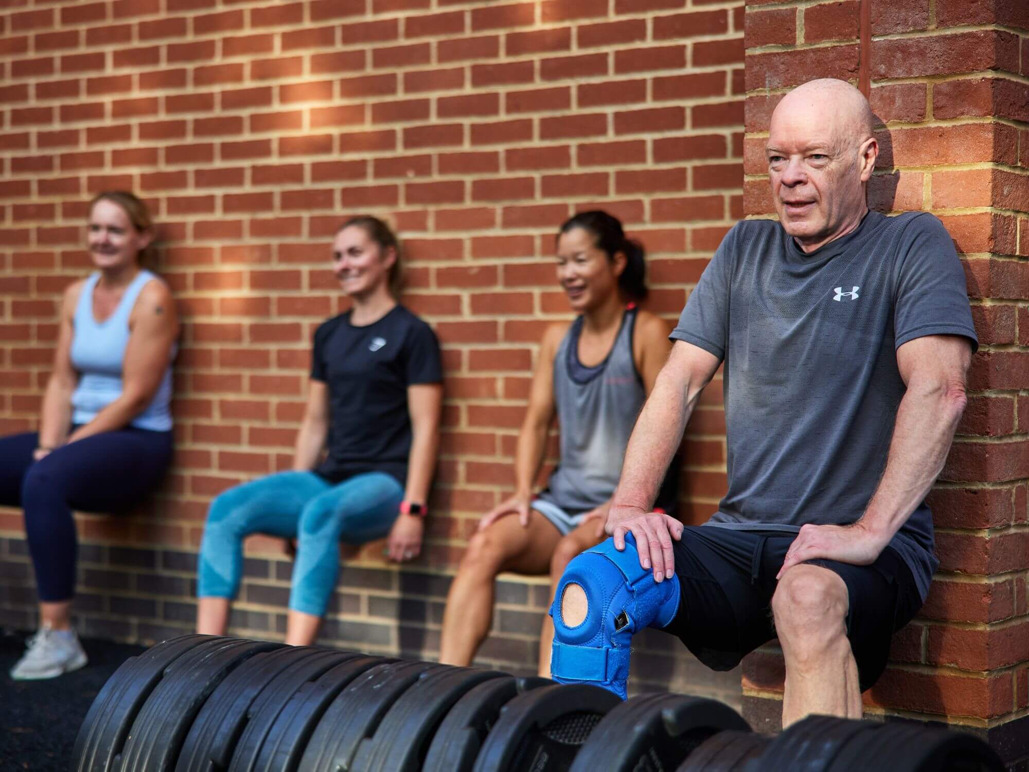 four people stretching