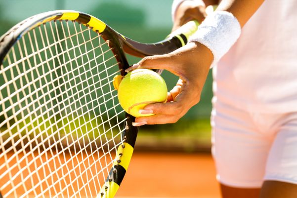 woman getting ready to hit tennis call