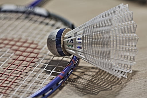 a shuttlecock on top of a badminton racket