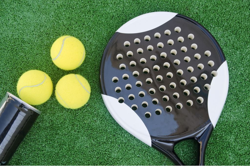 Padel racket and three balls