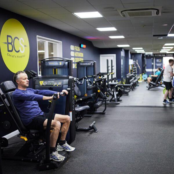 Man working out on fitness equipment in Bluecoat Sport