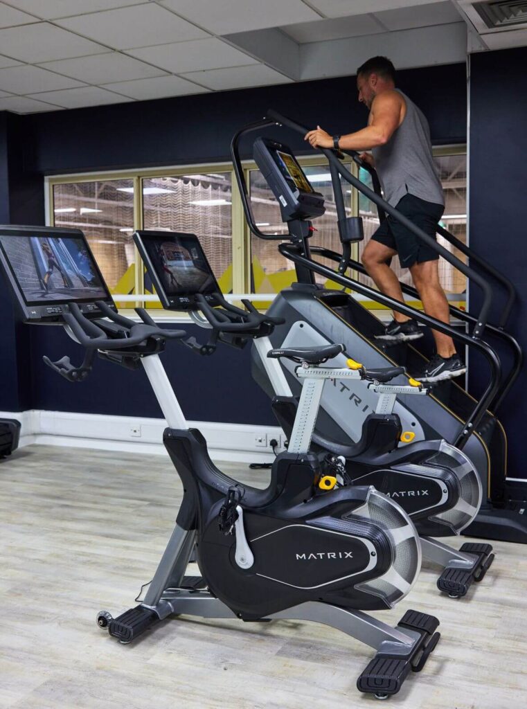 Man working out at bluecoat sports on the step machine