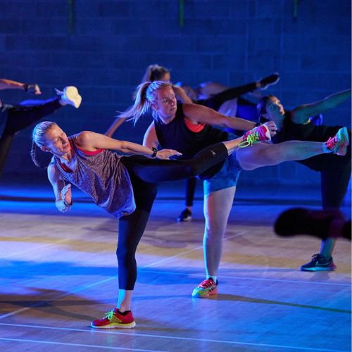 A group of women doing a body combat class