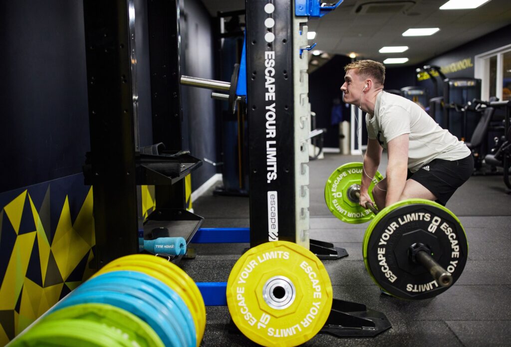 Man weight lifting at Bluecoat Sports gym