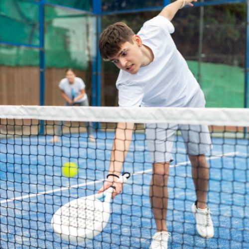 Young man playing padel