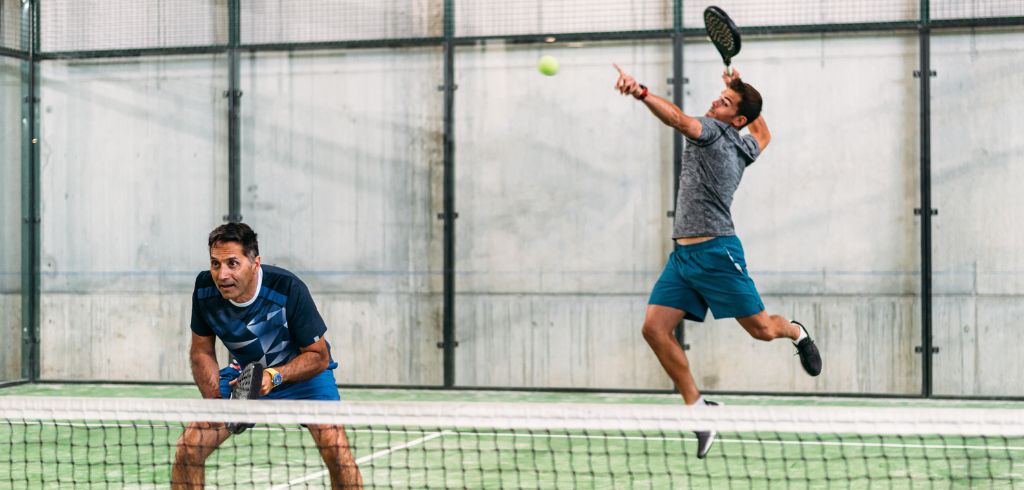 Two men playing padel