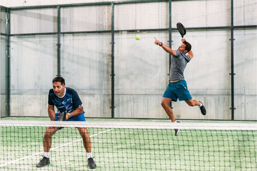 two men playing padel