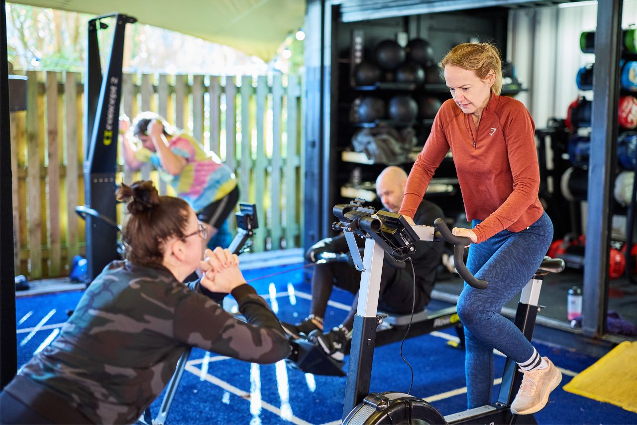 Woman riding a gym bike