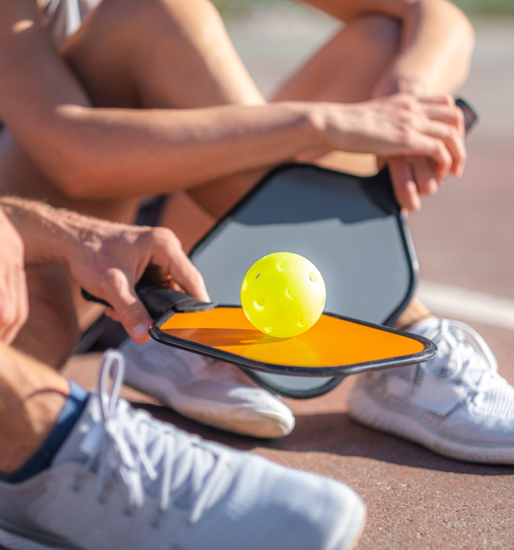 pickelball equipment, ball, paddle and footwear