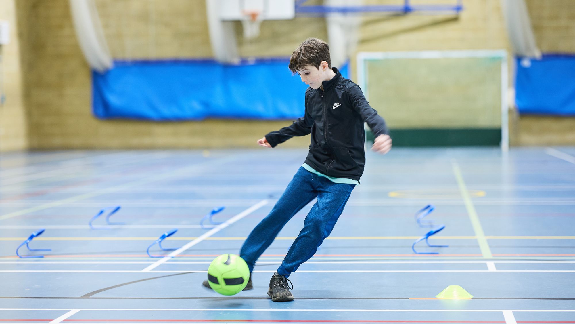 Boy at football coaching at Bluecoat Sports