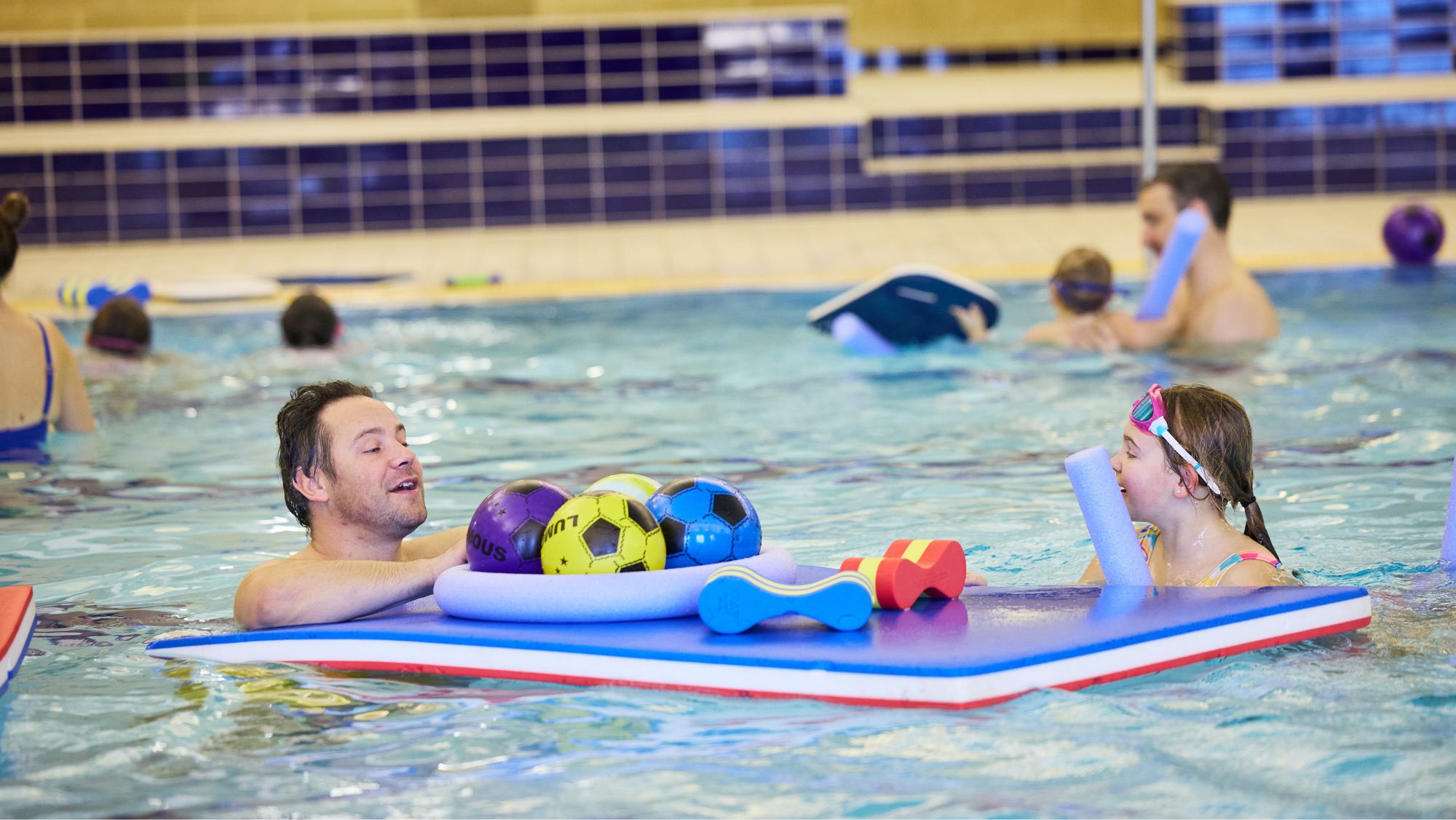 Family playing in swimming pool