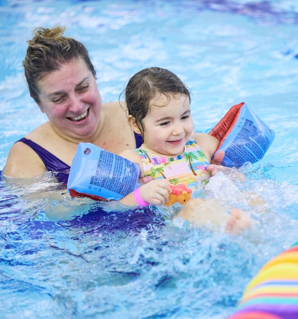 Mum and daughter in pool