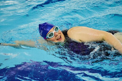 woman swimming smiling