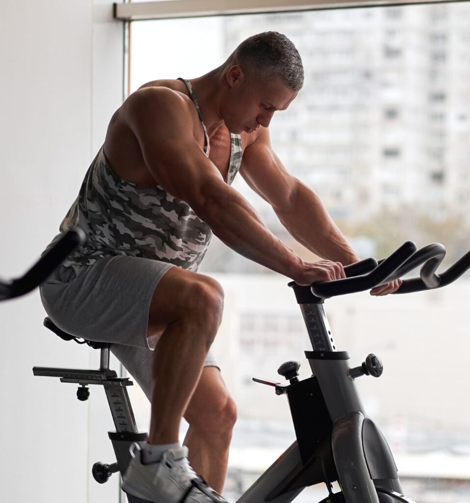 man on indoor cycling bike
