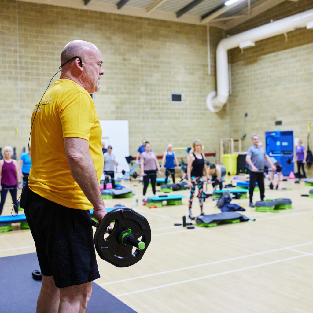 male instructor instructing a group fitness class at bluecoat sports