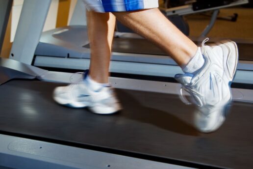 close up of persons shoes running on treadmill