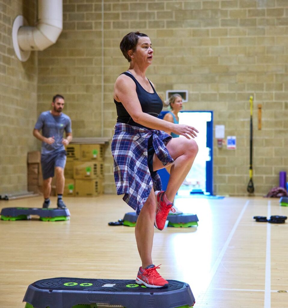 woman in a step fitness class