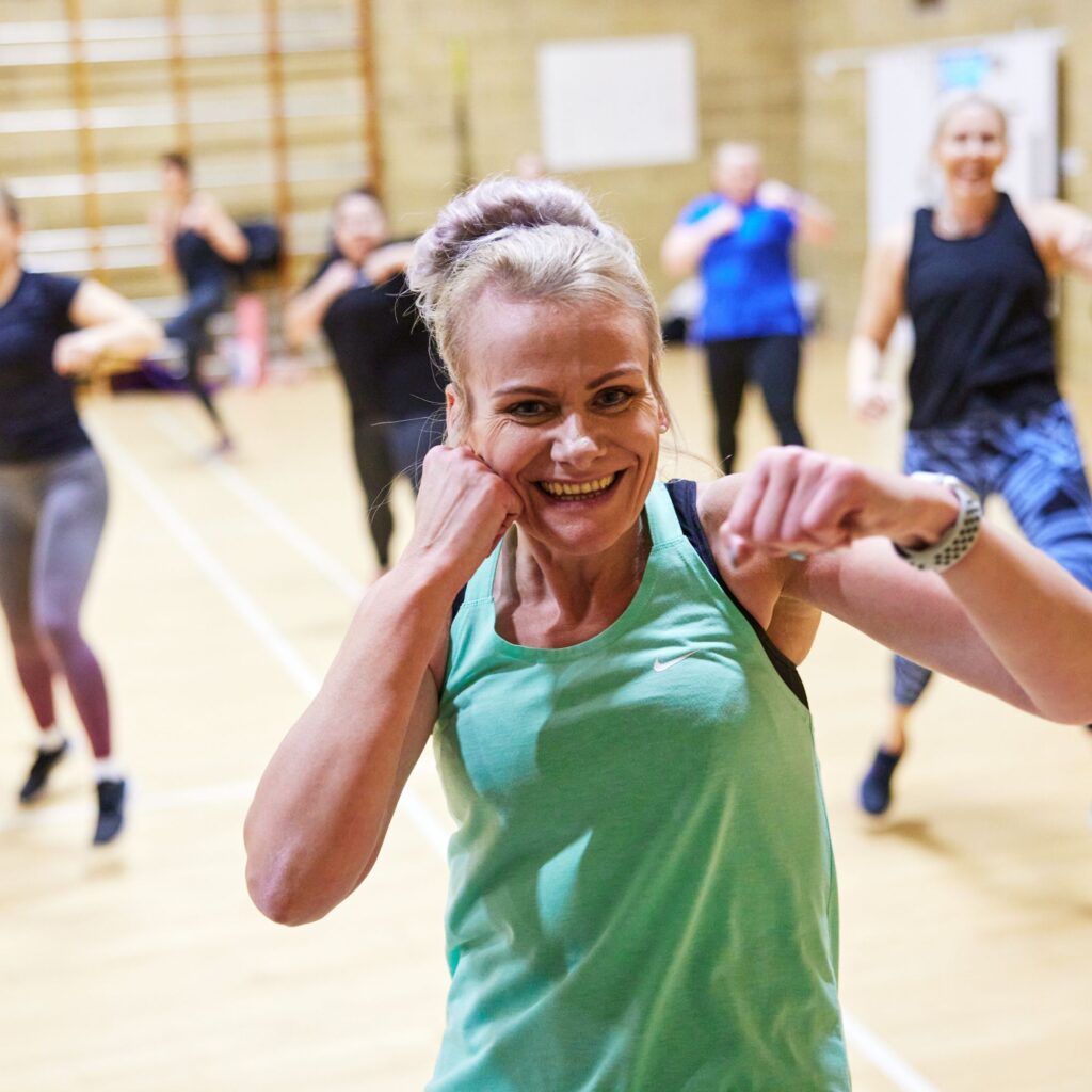 woman in group fitness class