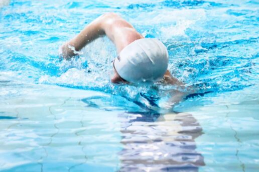 man swimming in swimming pool