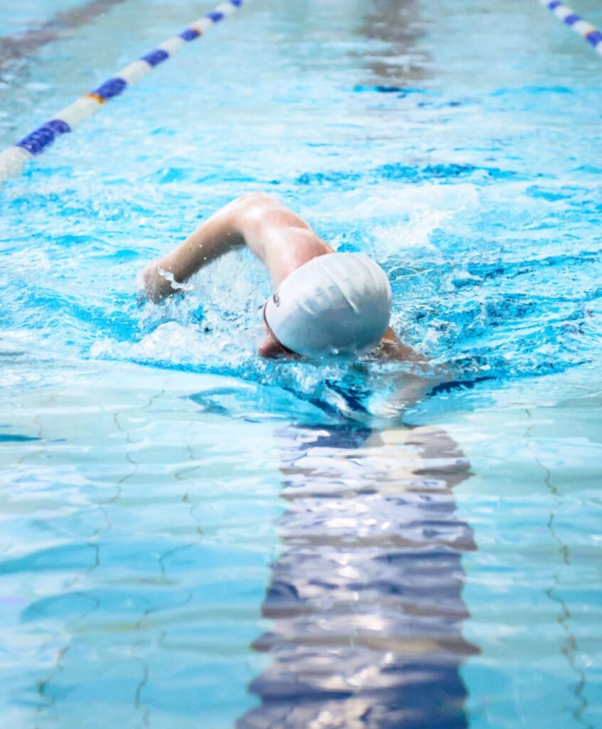 man swimming in swimming pool