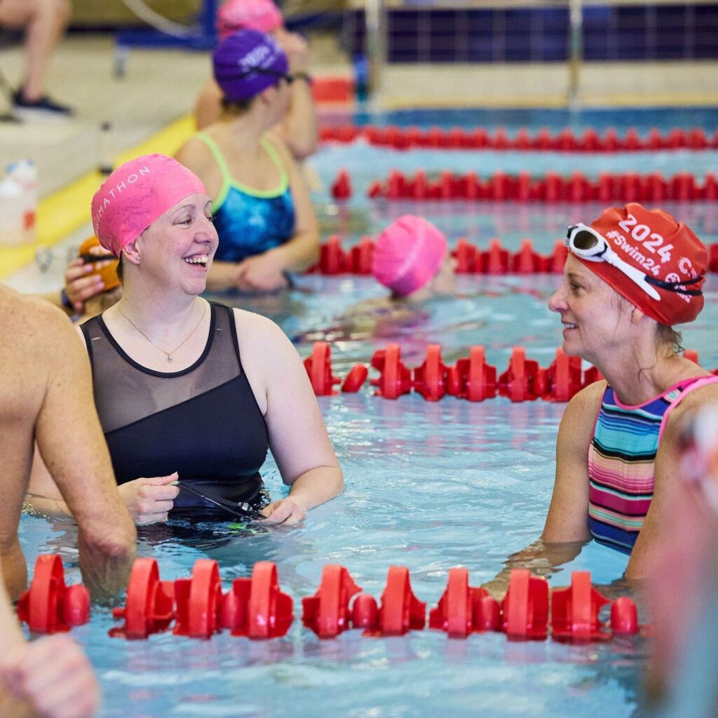 women in pool at swimathon