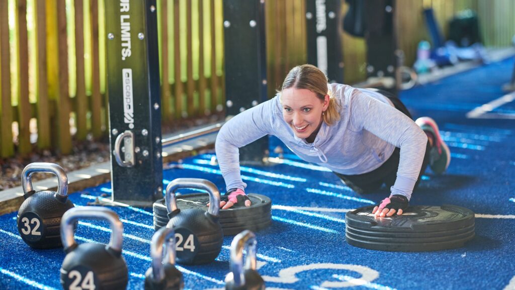 woman doing press ups in outdoor fitness yard