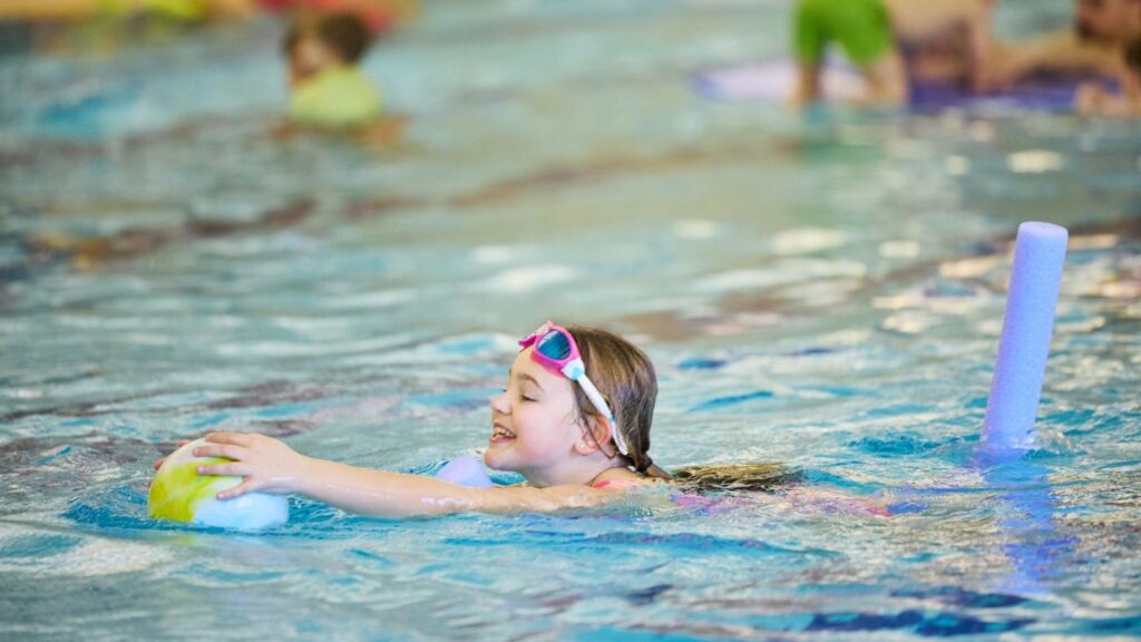 children playing in the swimming pool at bluecoat sports