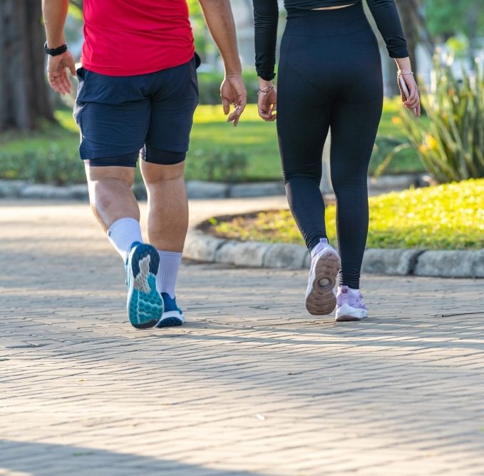 couple walking in park for exercise