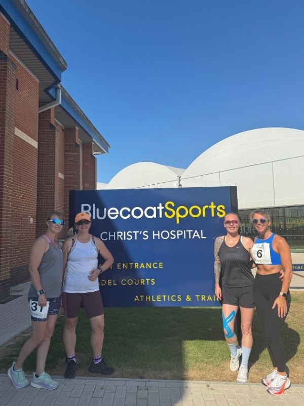 yard games participants in front of bluecoat sports sign
