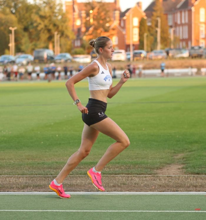 female runner on athletics track