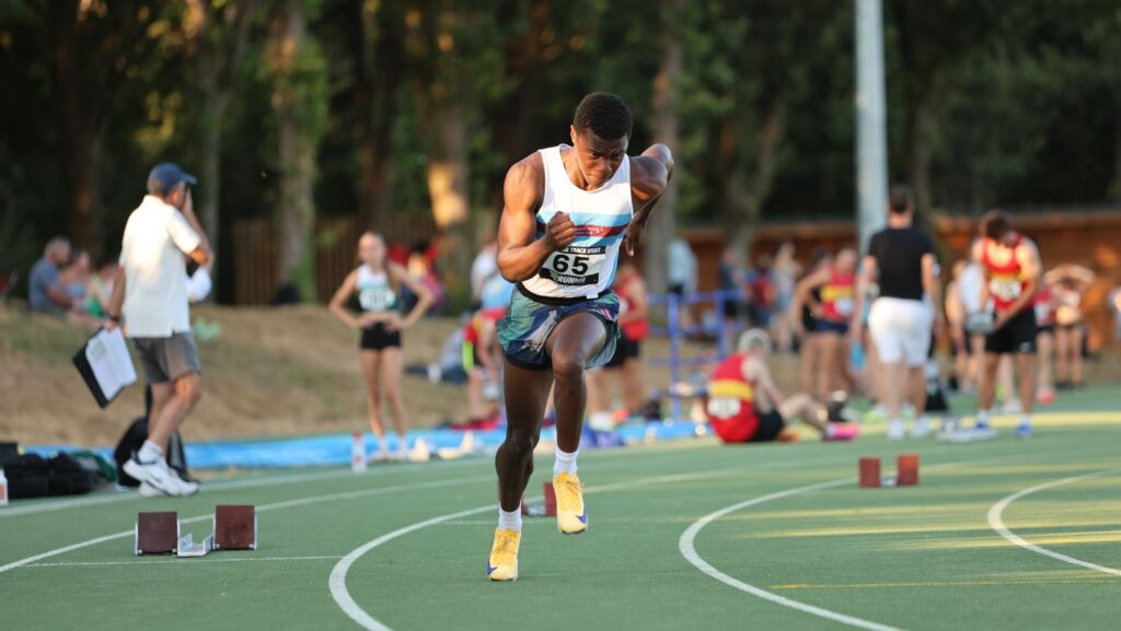 Runner sprinting on athletics track