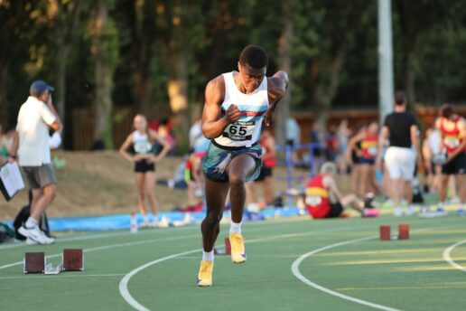 Runner sprinting on athletics track