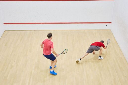 two males playing squash at bluecoat sports
